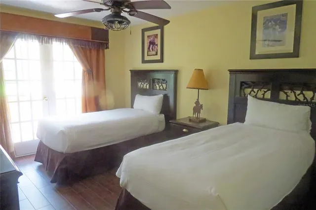 a bedroom with bed and a window