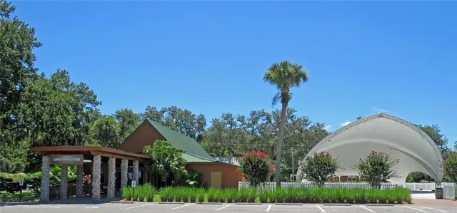 a view of a golf course with chairs
