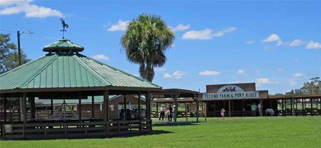 a view of a cafe with a couple of people seating