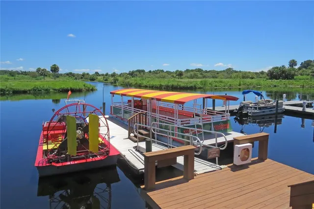 a front view of a building with outdoor seating