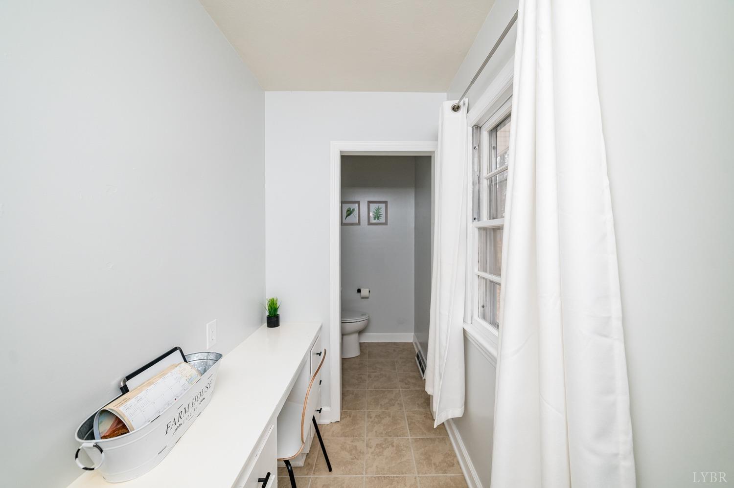 286 Flat Woods Road Amherst, VA 24521 - Photo 19 of 58 a hallway with table and chairs