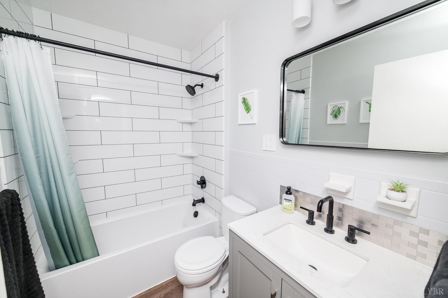 286 Flat Woods Road Amherst, VA 24521 - Photo 21 of 58 a bathroom with a sink toilet and shower