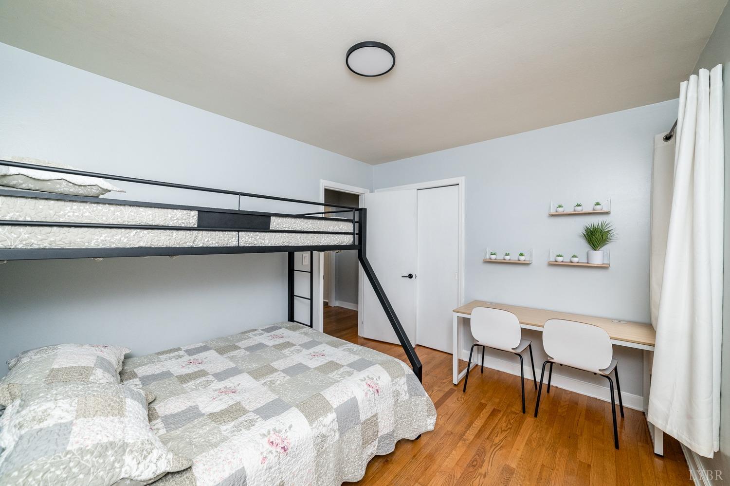 286 Flat Woods Road Amherst, VA 24521 - Photo 23 of 58 a bedroom with a bed and a wooden floor