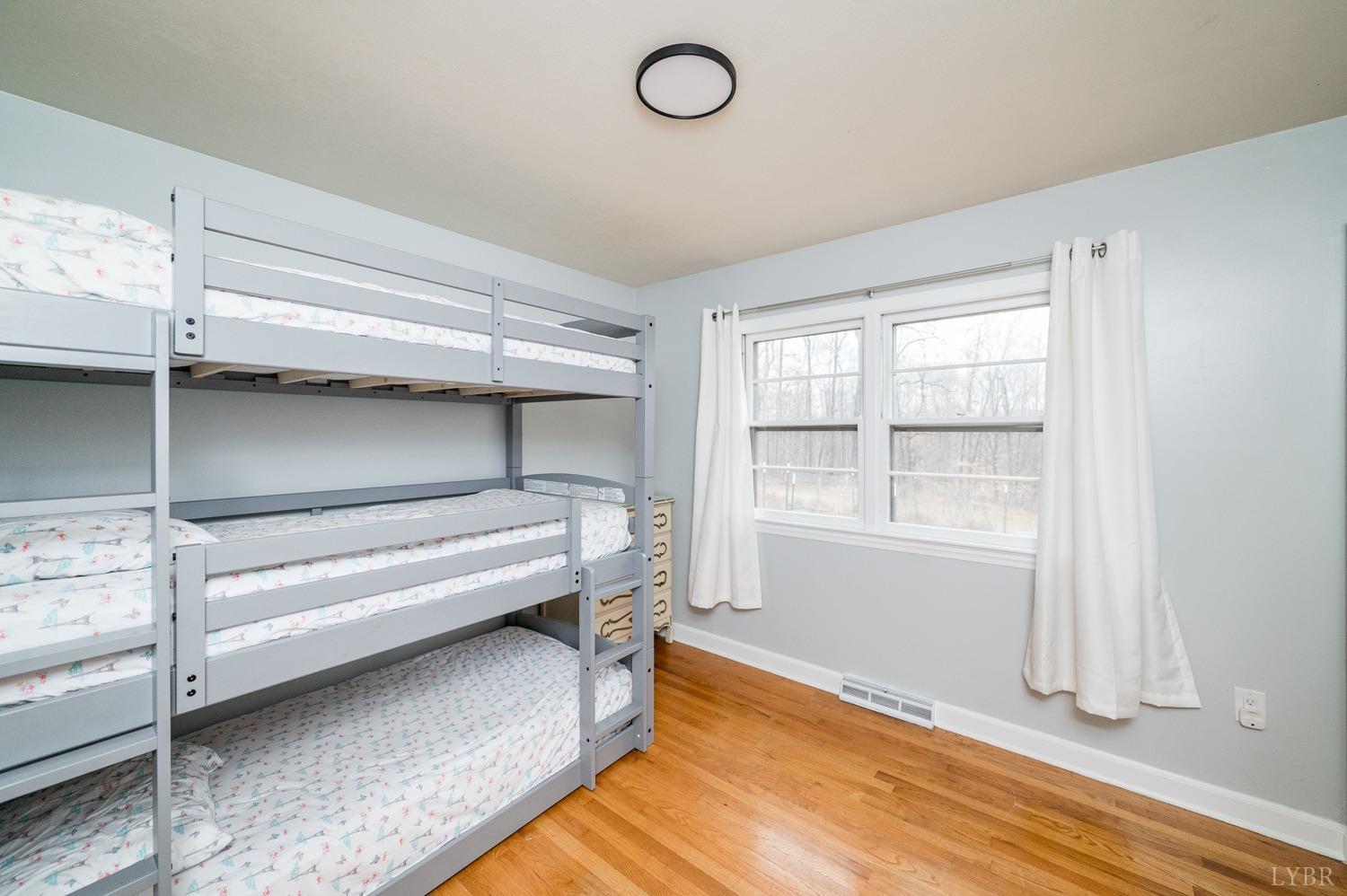 286 Flat Woods Road Amherst, VA 24521 - Photo 24 of 58 a view of room with window and wooden floor