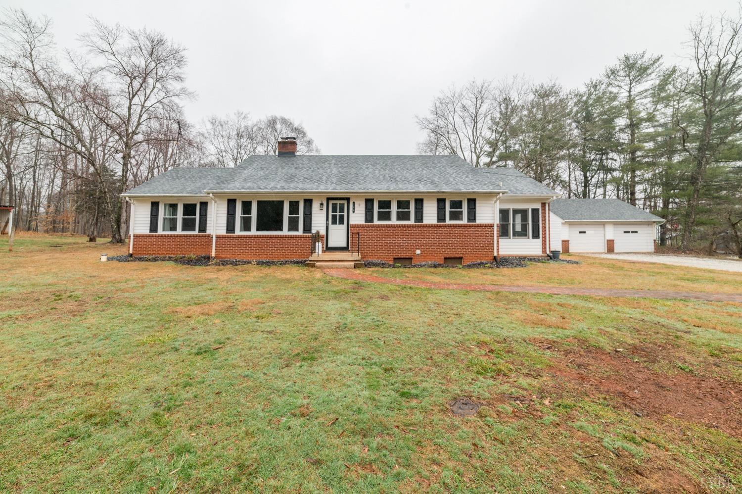286 Flat Woods Road Amherst, VA 24521 - Photo 42 of 58 a front view of a house with a yard and trees