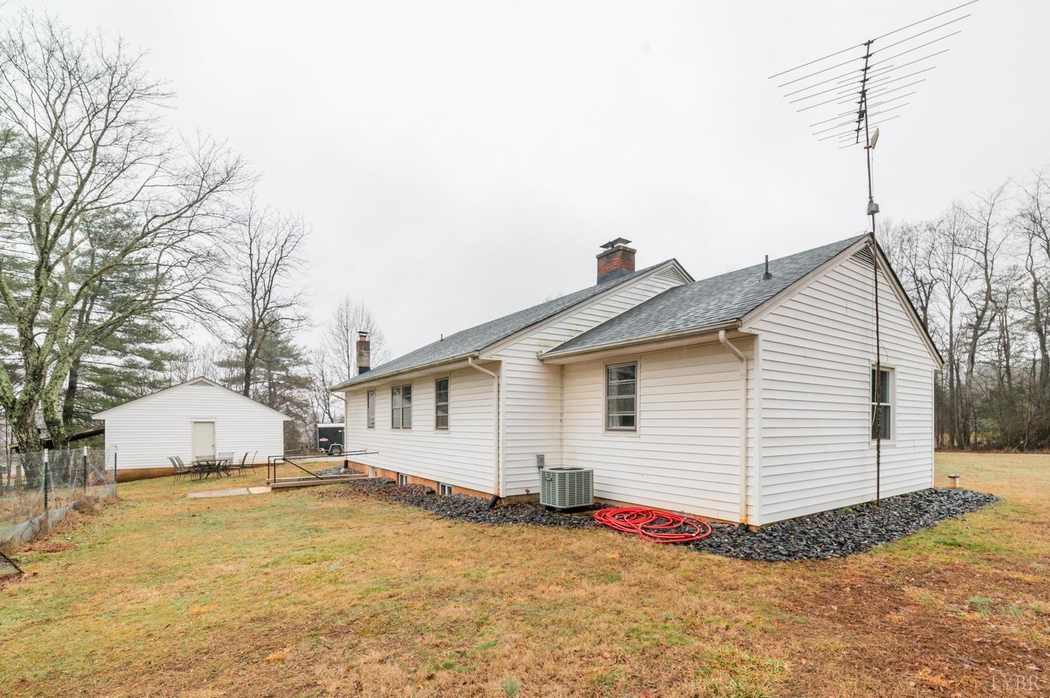 286 Flat Woods Road Amherst, VA 24521 - Photo 45 of 58 a view of a white house with a yard