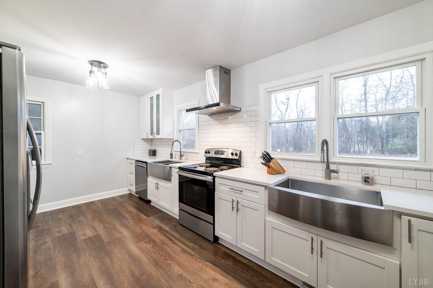 286 Flat Woods Road Amherst, VA 24521 - Photo 10 of 58 a kitchen with stainless steel appliances granite countertop a sink stove and refrigerator