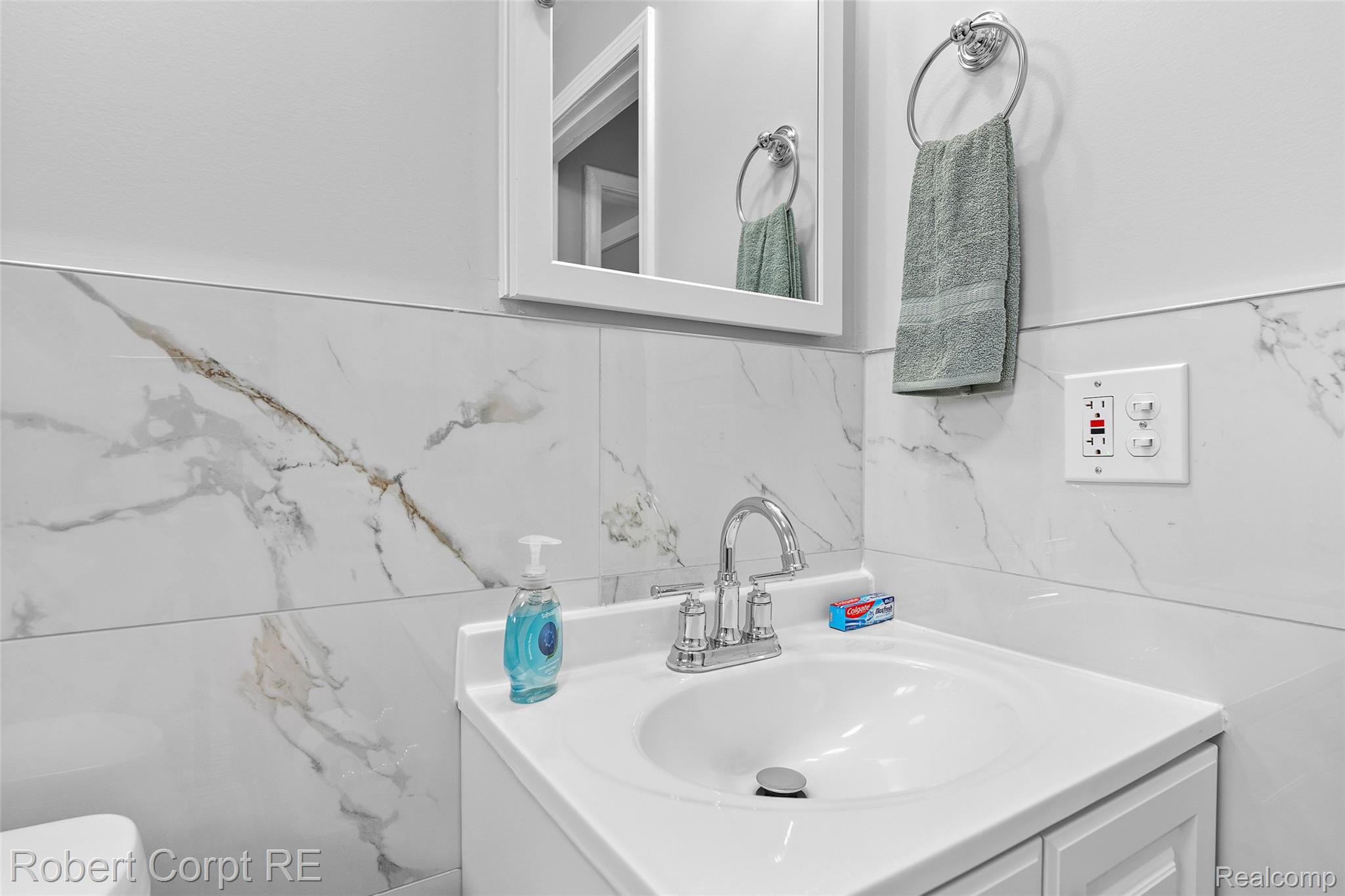 4772 Harding Street Dearborn Heights, MI 48125 - Photo 8 of 22 Half bathroom featuring vanity and tile walls