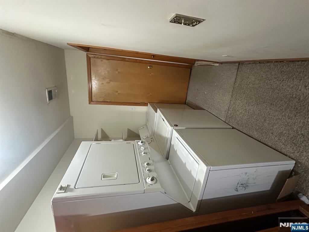 408 Jersey Street Harrison, NJ 07029 - Photo 9 of 10 a utility room with cabinets washer and dryer