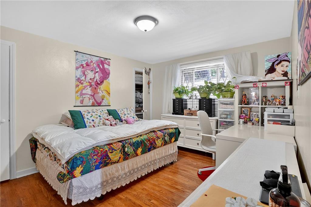 5765 Library Road Bethel Park, PA 15102 - Photo 15 of 34 a bedroom with a bed a couch and a window