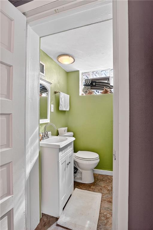 5765 Library Road Bethel Park, PA 15102 - Photo 17 of 34 a bathroom with a toilet a sink and a mirror