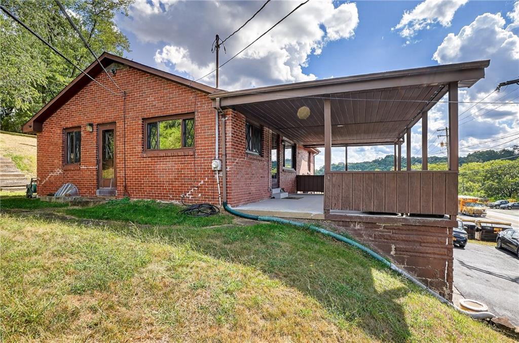 5765 Library Road Bethel Park, PA 15102 - Photo 27 of 34 a front view of a house with garden