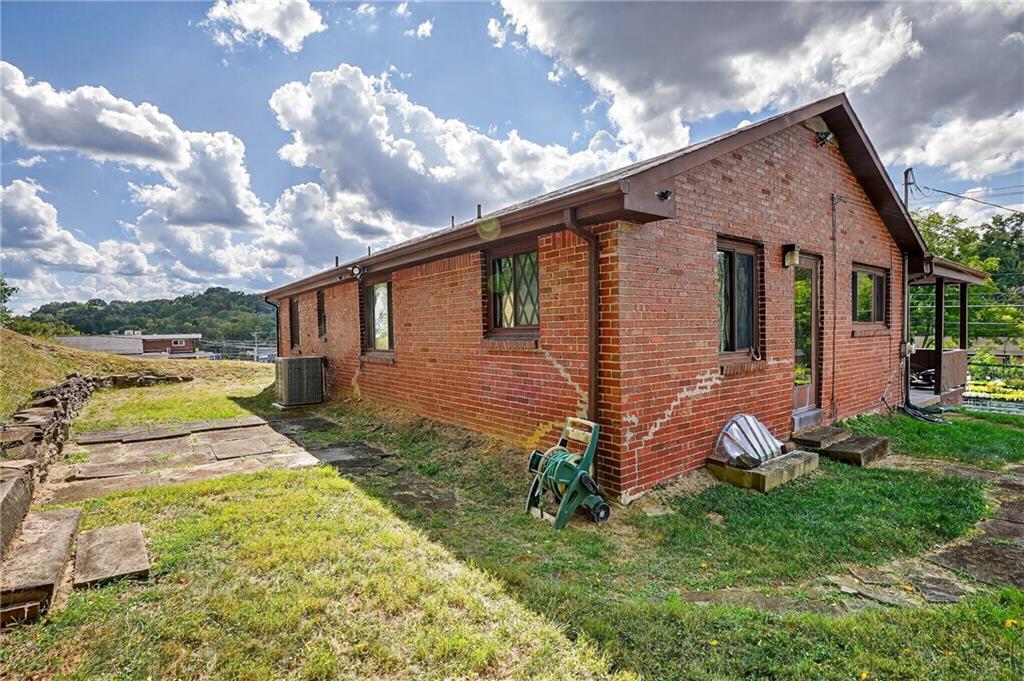 5765 Library Road Bethel Park, PA 15102 - Photo 30 of 34 a front view of a house with garden