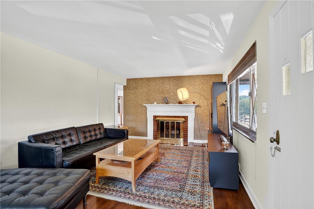 5765 Library Road Bethel Park, PA 15102 - Photo 3 of 34 a living room with furniture and a fireplace