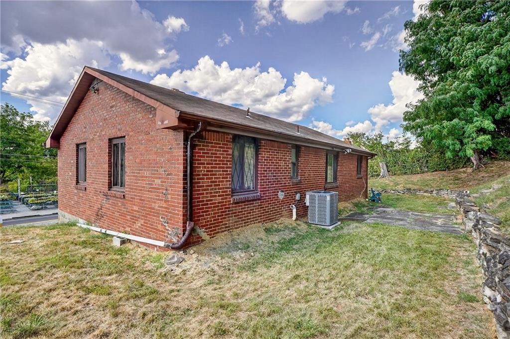 5765 Library Road Bethel Park, PA 15102 - Photo 31 of 34 a view of a house with backyard