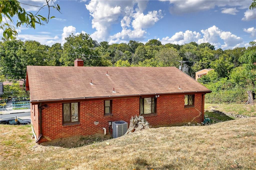 5765 Library Road Bethel Park, PA 15102 - Photo 34 of 34 a backyard of a house with table and chairs