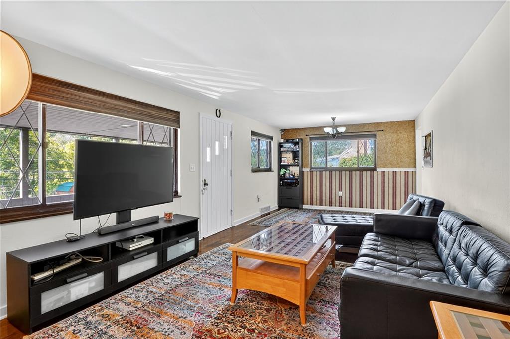 5765 Library Road Bethel Park, PA 15102 - Photo 7 of 34 a living room with furniture and a flat screen tv