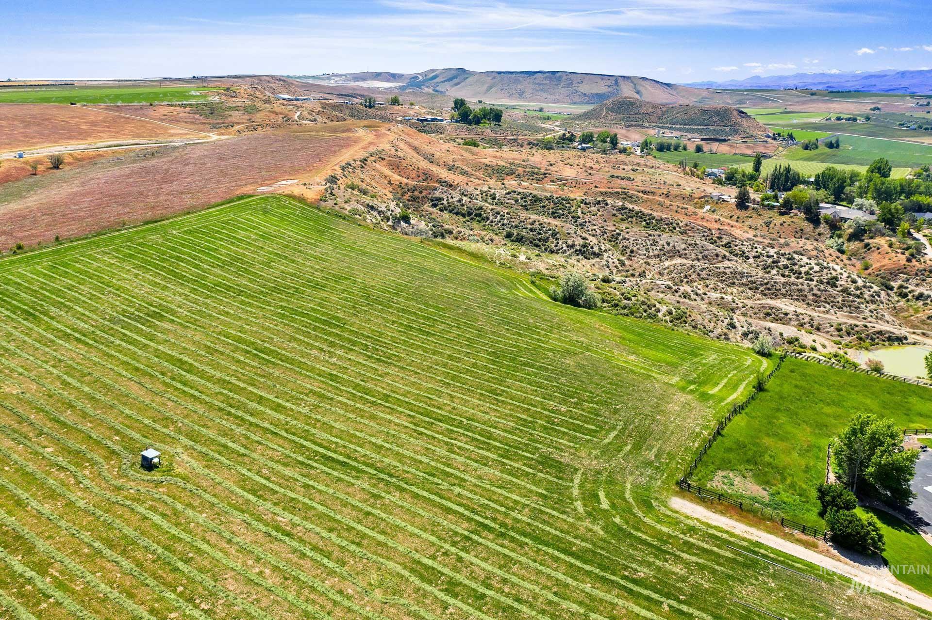 Tbd Randall Lane Caldwell, ID 83607 - Photo 1 of 13 Aerial view of sparsely populated area with a mountain backdrop