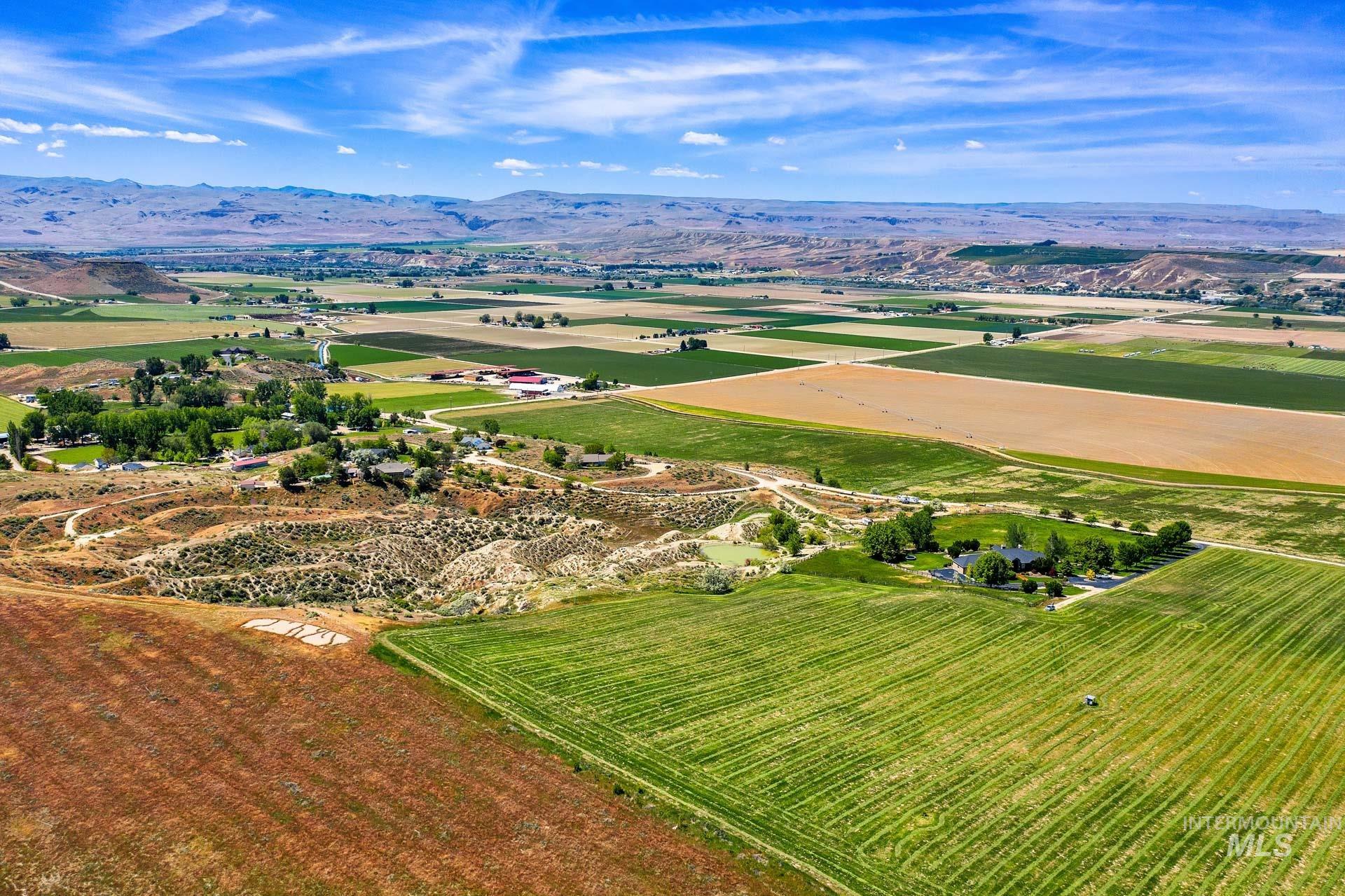 Tbd Randall Lane Caldwell, ID 83607 - Photo 3 of 13 View of property location with rows of crops, rural landscape, and a mountainous background