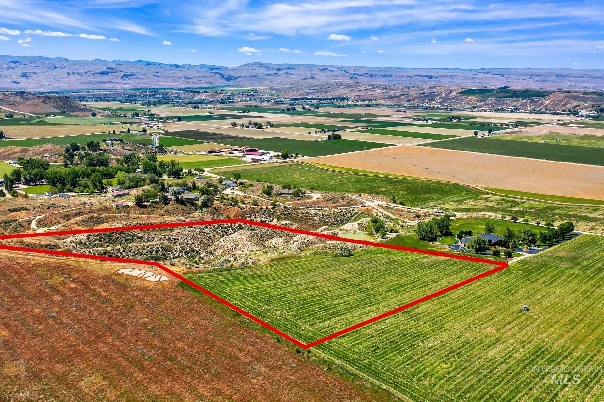 Tbd Randall Lane Caldwell, ID 83607 - Photo 4 of 13 Aerial view of property and surrounding area featuring rural landscape, property boundaries highlighted, and a mountain backdrop