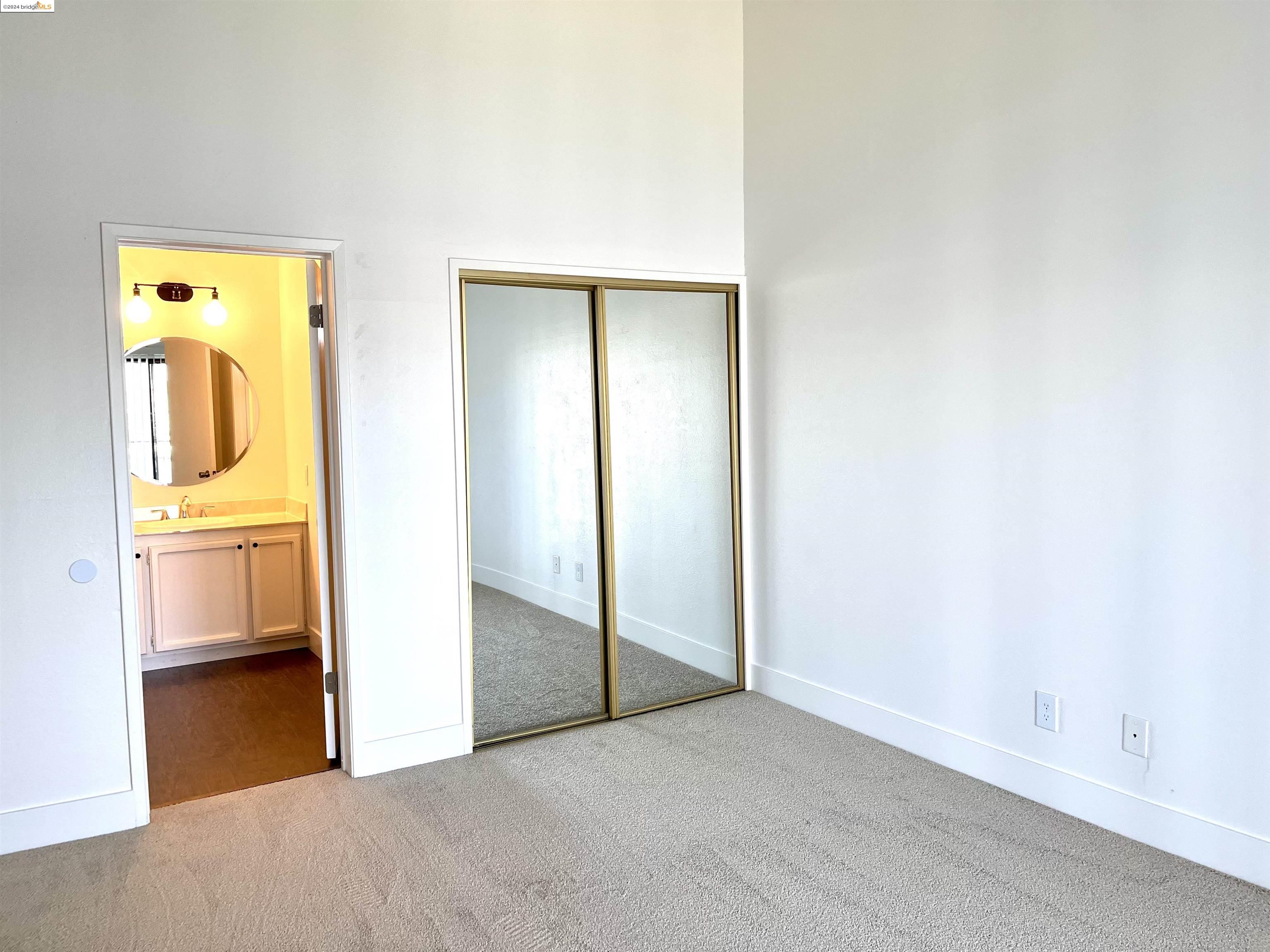5651 Schooner Loop Discovery Bay, CA 94505 - Photo 14 of 16 a view of a hallway with wooden floor