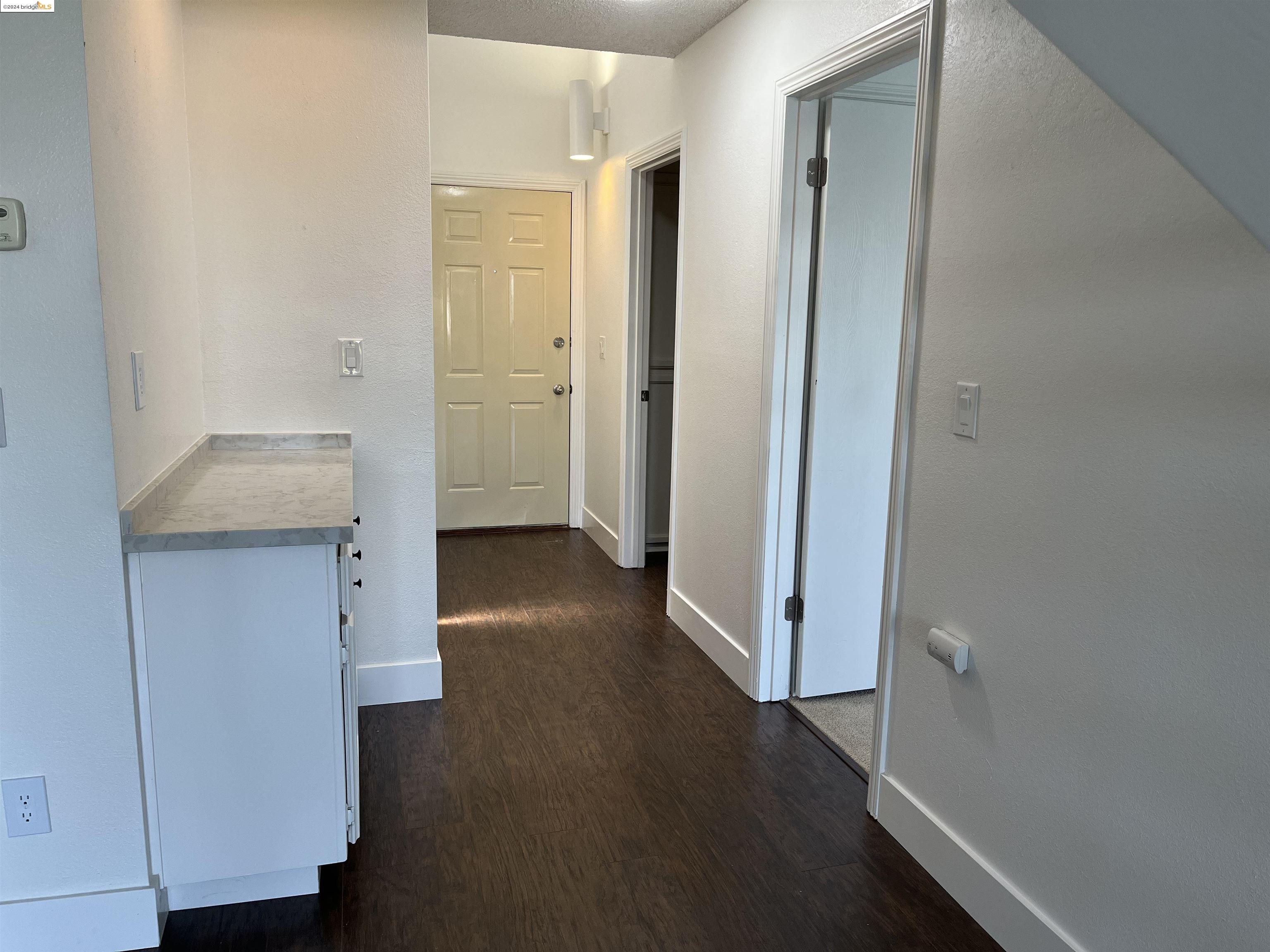 5651 Schooner Loop Discovery Bay, CA 94505 - Photo 2 of 16 a view of a hallway with wooden floor