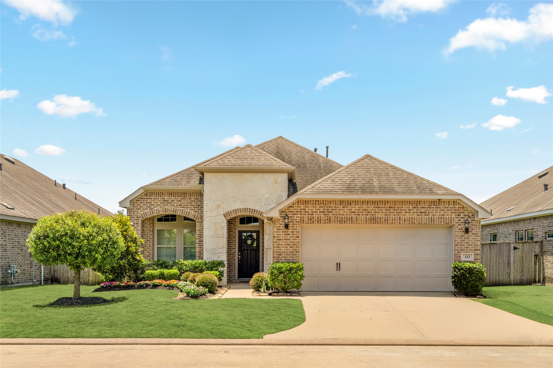 143 Castlegate Lane Houston, TX 77065 - Photo 31 of 33 143 Castlegate features many updates in garage: expanded storage area in attic with plywood (2018, 2021), storage cabinets installed (2020), installed wall storage capacity for bikes, tools, brooms.