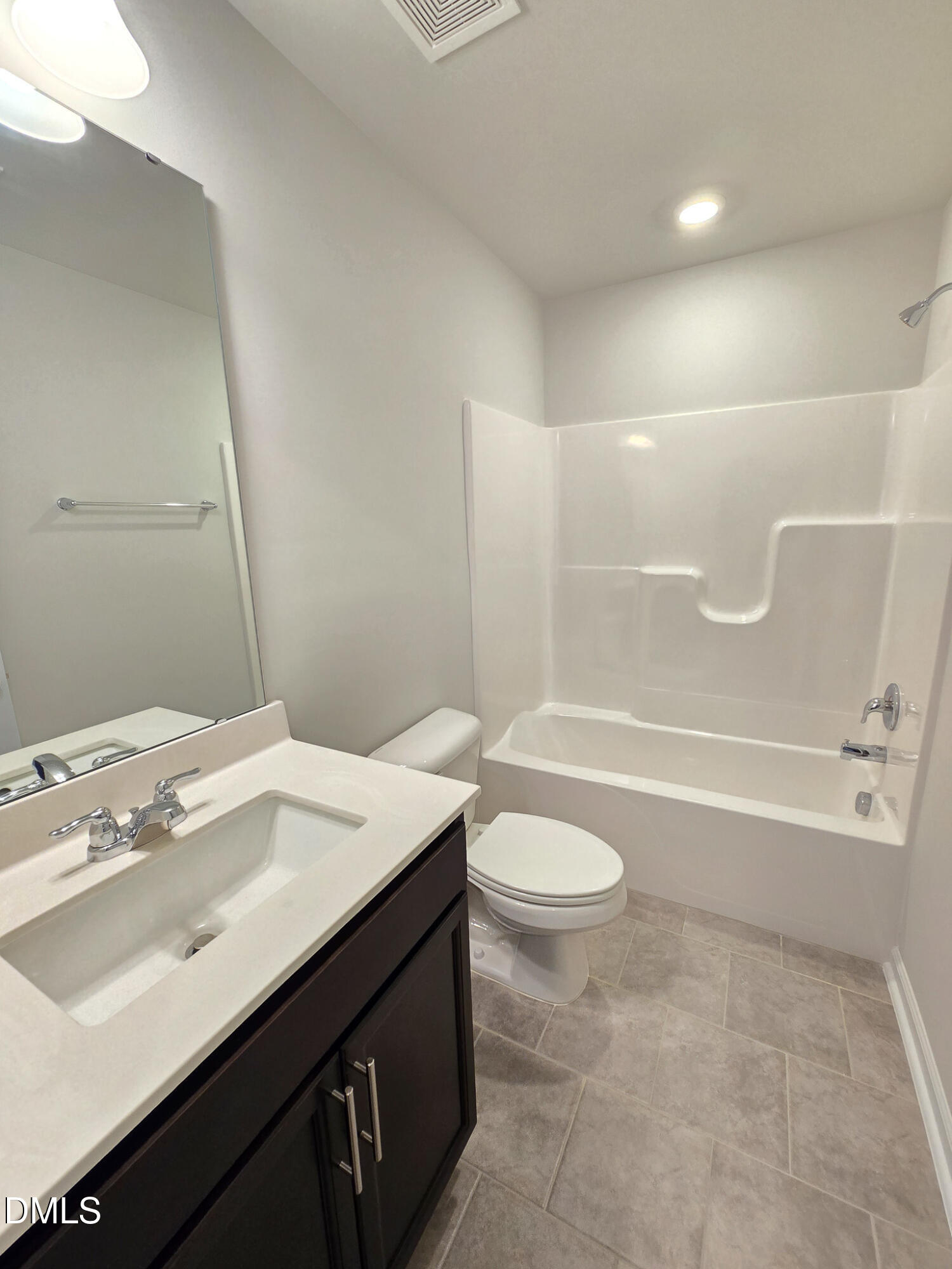 2431 Kasota Lane Raleigh, NC 27610 - Photo 9 of 46 a bathroom with a sink a toilet and shower