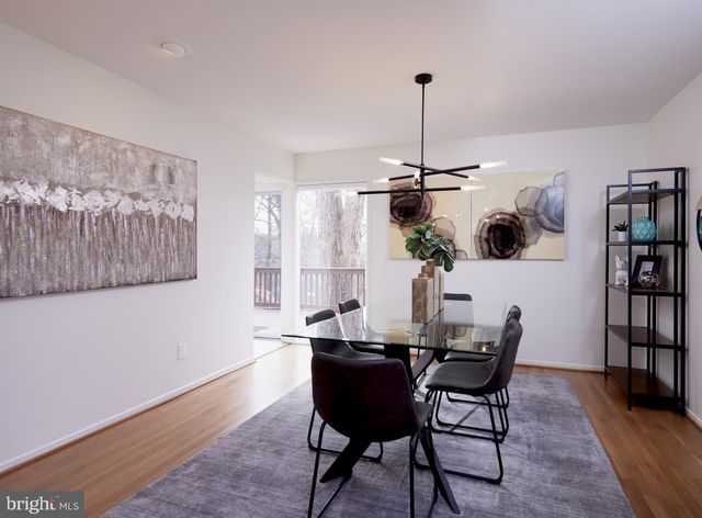 a view of a dining room with furniture and a table