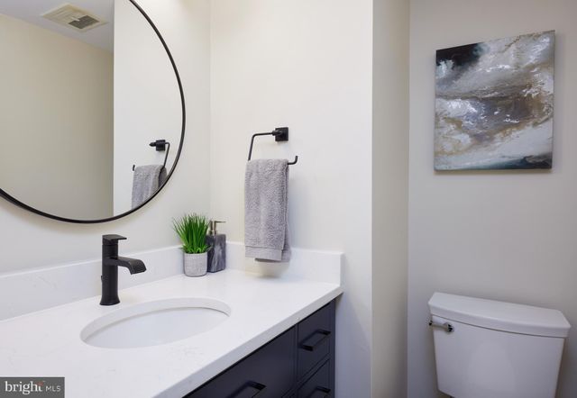 a view of a hallway view with wooden floor and staircase