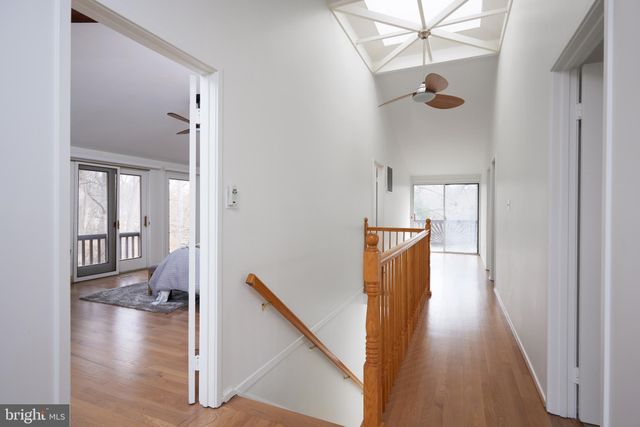 a bed room with a bed couch and a window