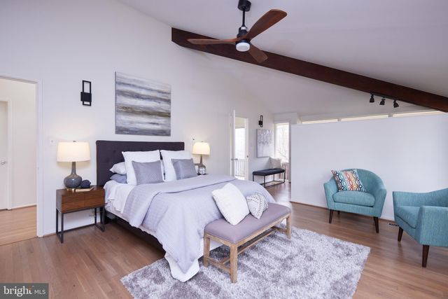 a bathroom with a bathtub a sink and a window