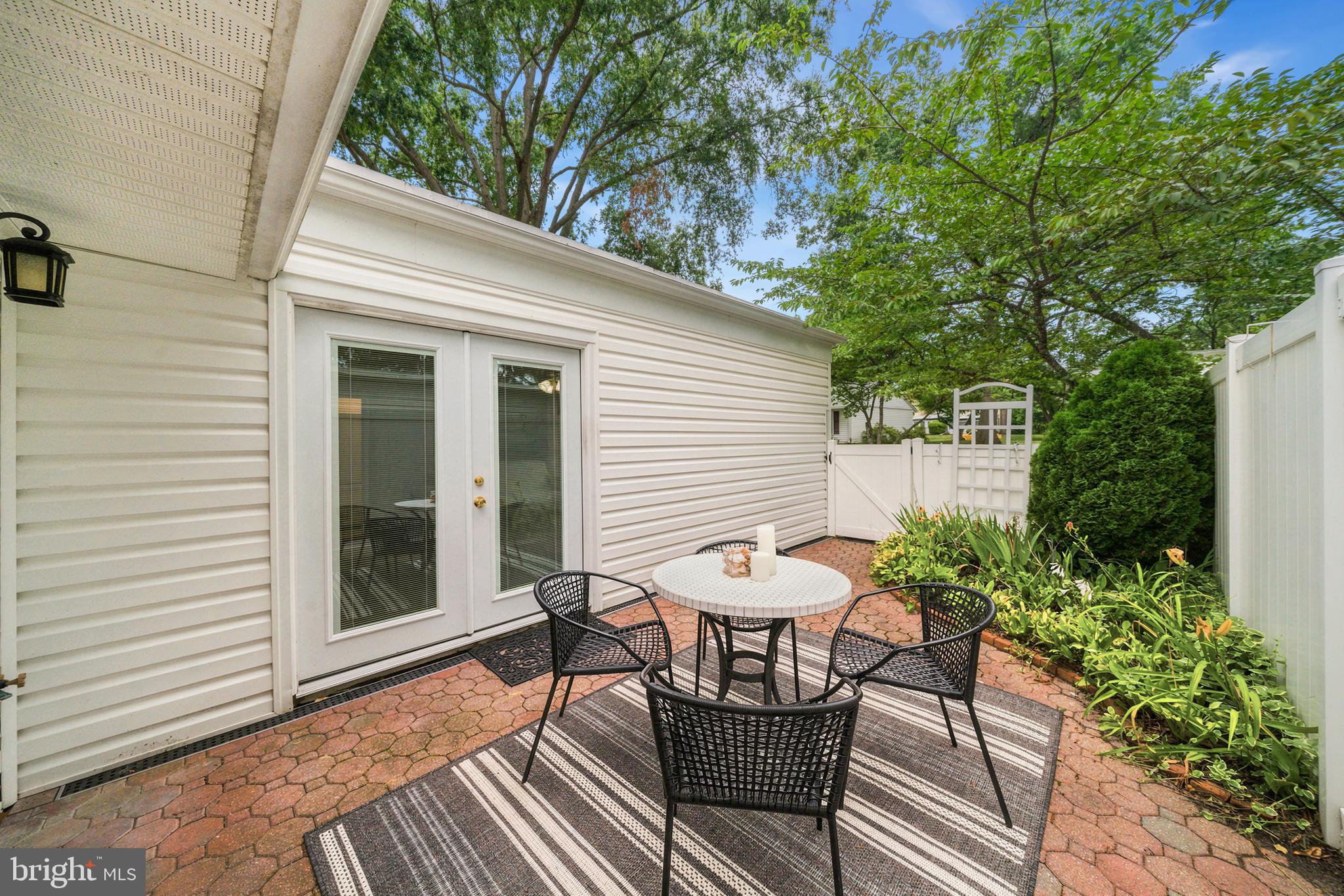 14601 Deerhurst Terrace Silver Spring, MD 20906 - Photo 34 of 51 a view of a chair and table in backyard of the house