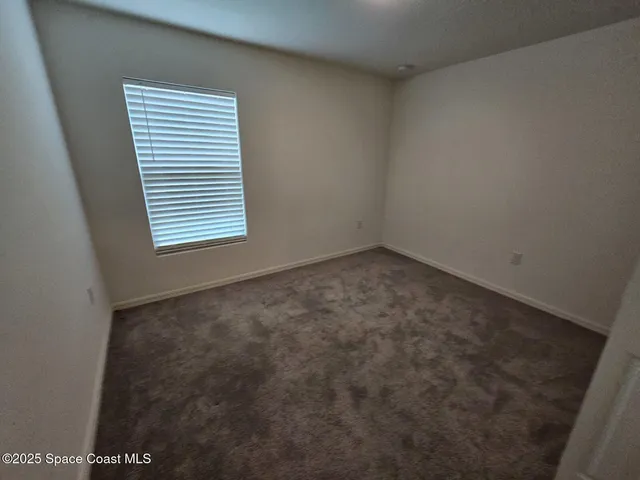 a view of room with hardwood floor
