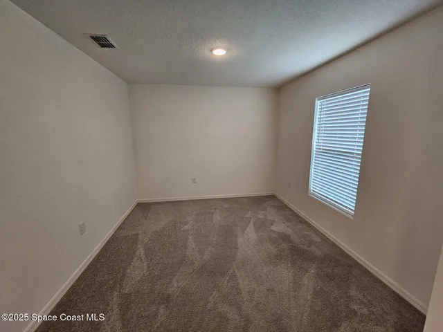 a view of a room that has a window in it