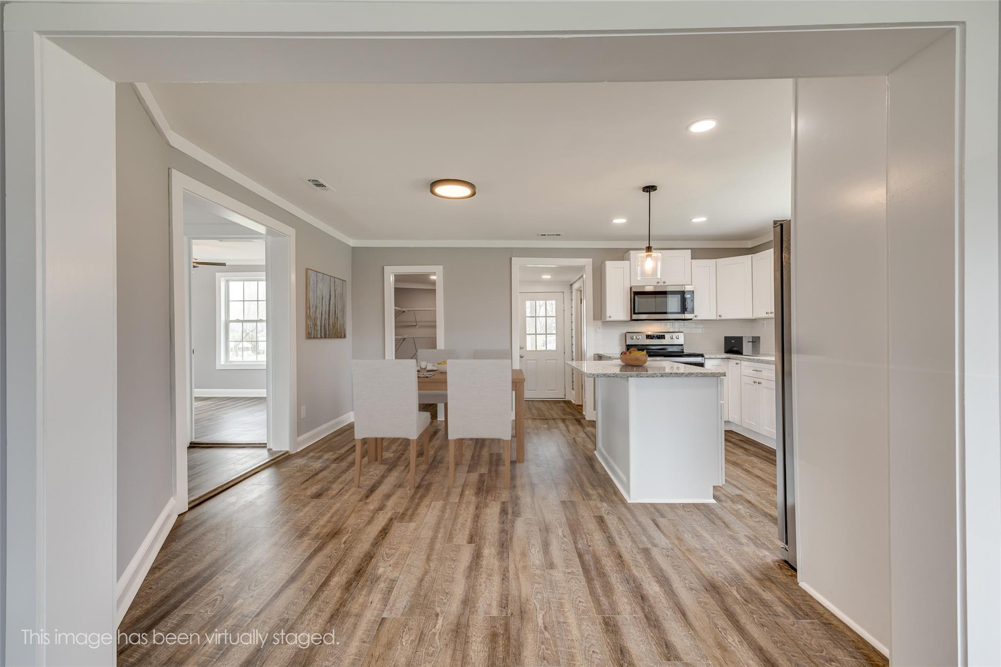 6773 Shiloh Unity Road Lancaster, SC 29720 - Photo 3 of 16 a view of kitchen with wooden floor and electronic appliances
