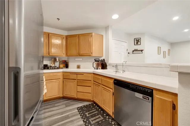 a kitchen with a sink cabinets and window