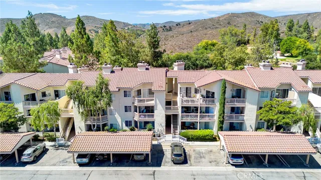 an aerial view of a house with a garden and balcony