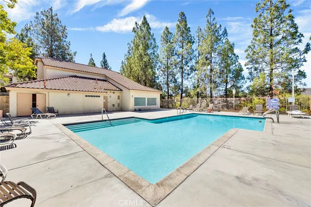 a view of a white house with a yard
