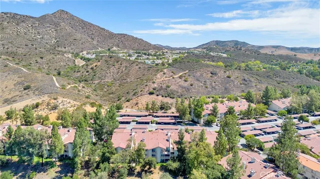 a view of a city with mountains in the background