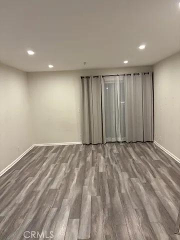 a view of a kitchen with wooden floor