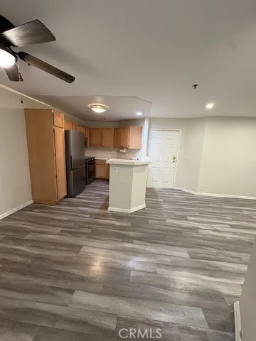 wooden floor in an empty room with a fireplace