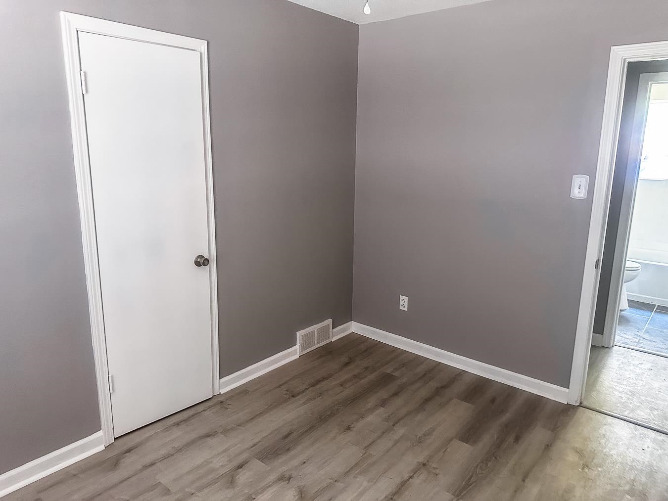 3909 Range Line Road Memphis, TN 38127 - Photo 19 of 31 an empty room with wooden floor and entrance
