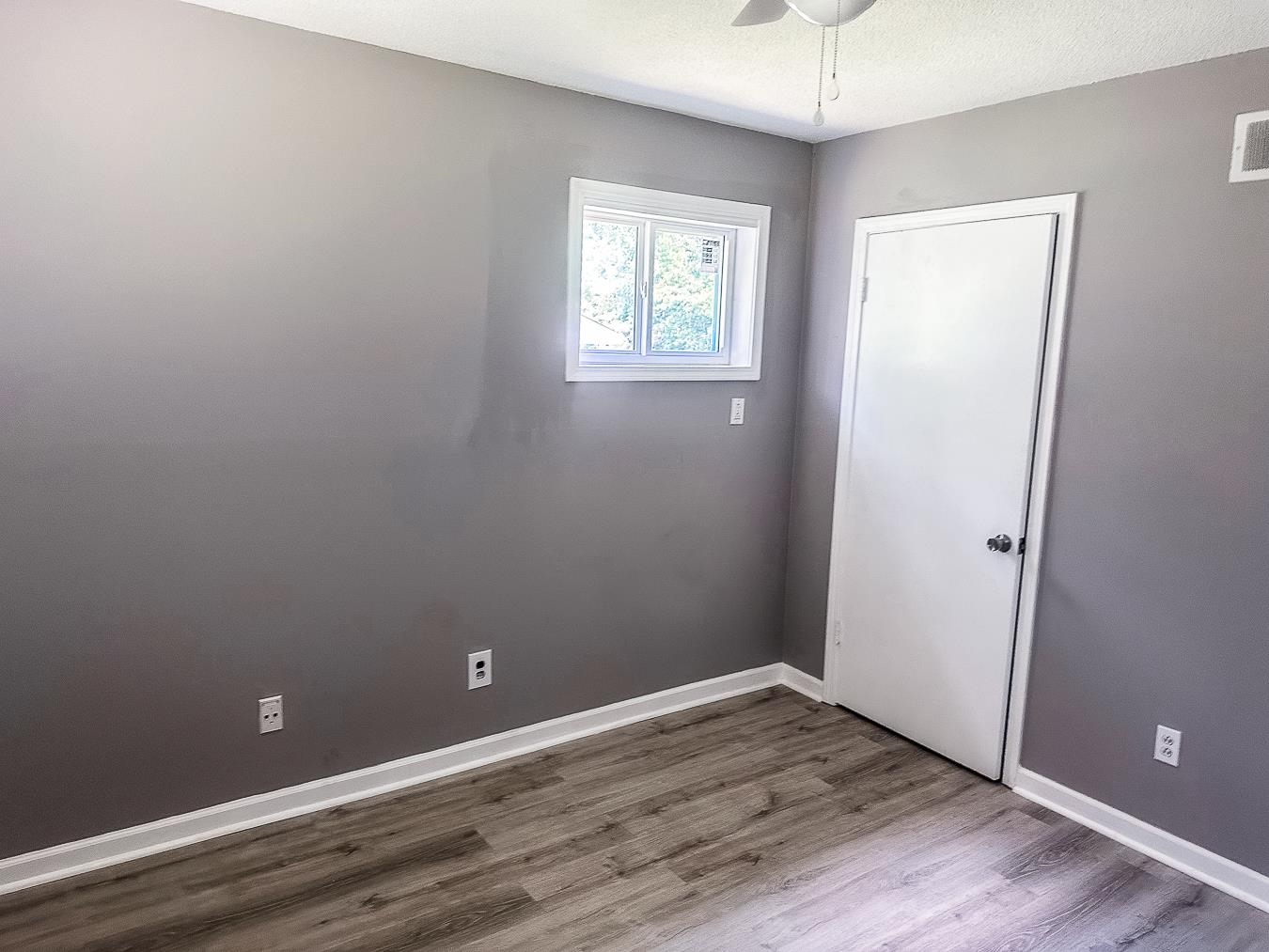 3909 Range Line Road Memphis, TN 38127 - Photo 23 of 31 wooden floor and window in an empty room