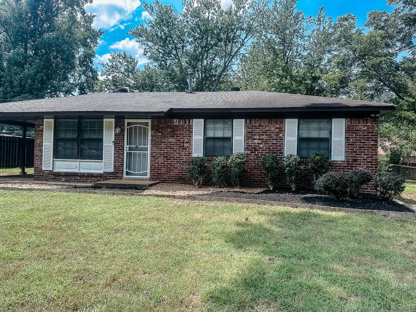 3909 Range Line Road Memphis, TN 38127 - Photo 24 of 31 a front view of a house with garden