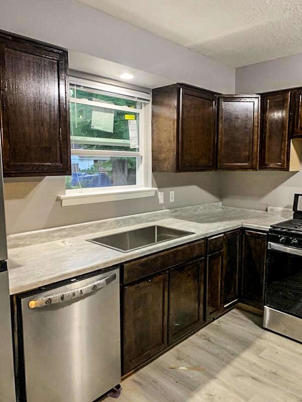 3909 Range Line Road Memphis, TN 38127 - Photo 26 of 31 a kitchen with a stove and a sink