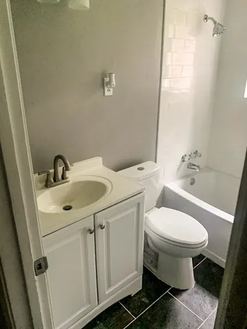 a view of a pool with an outdoor space and seating area