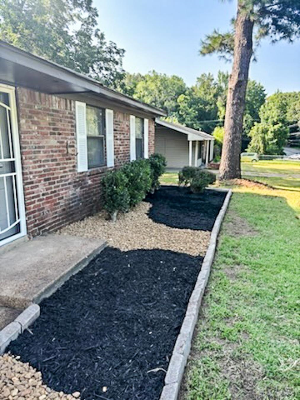 3909 Range Line Road Memphis, TN 38127 - Photo 4 of 31 a front view of a house with garden