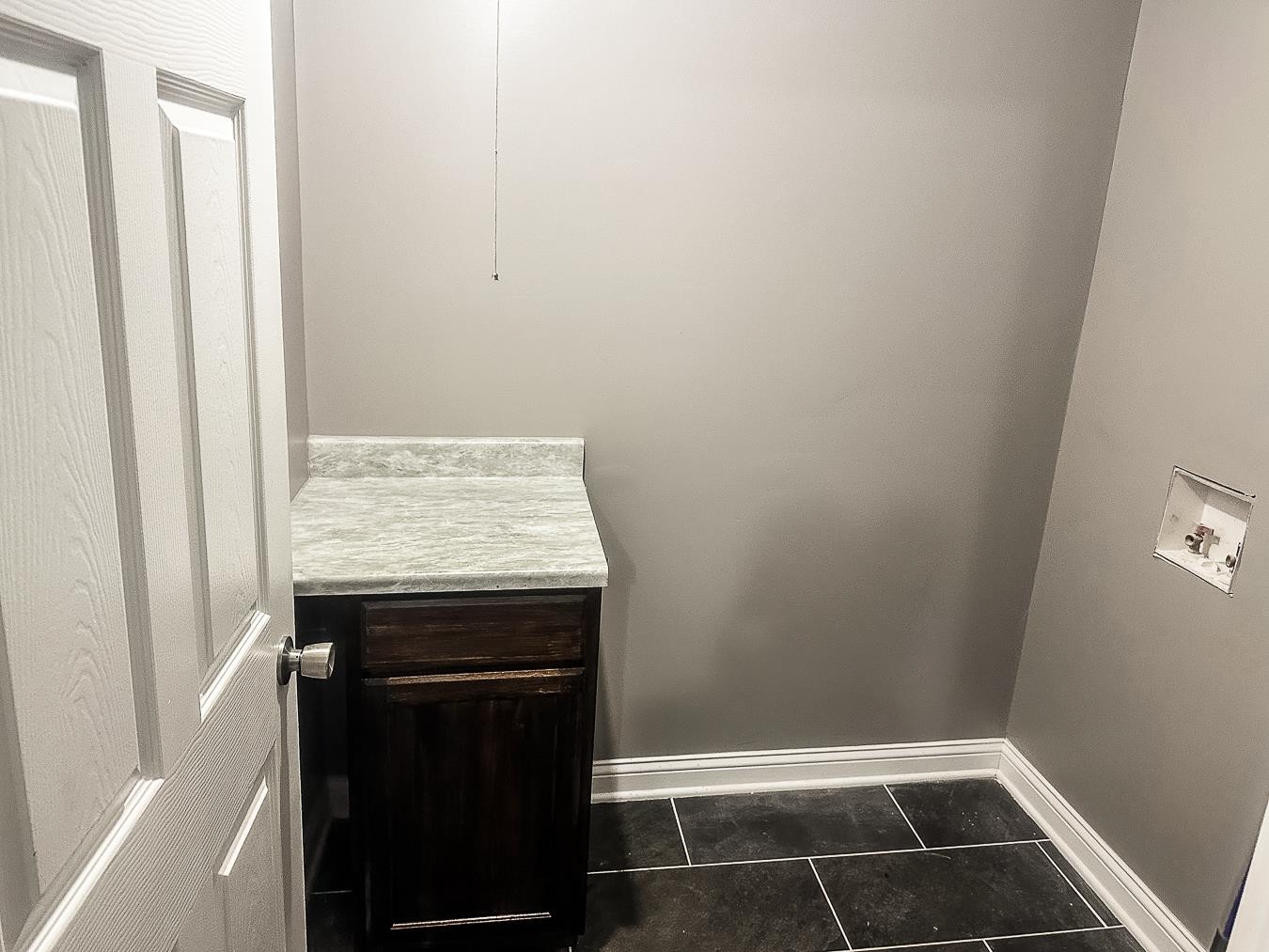 3909 Range Line Road Memphis, TN 38127 - Photo 7 of 31 a view of storage and utility room with washing machine