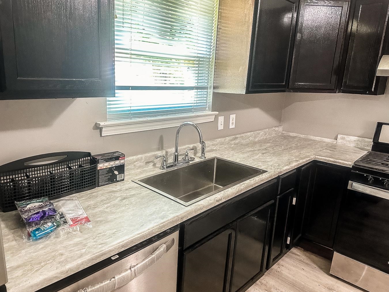 3909 Range Line Road Memphis, TN 38127 - Photo 10 of 31 a kitchen with stainless steel appliances granite countertop a sink stove and cabinets
